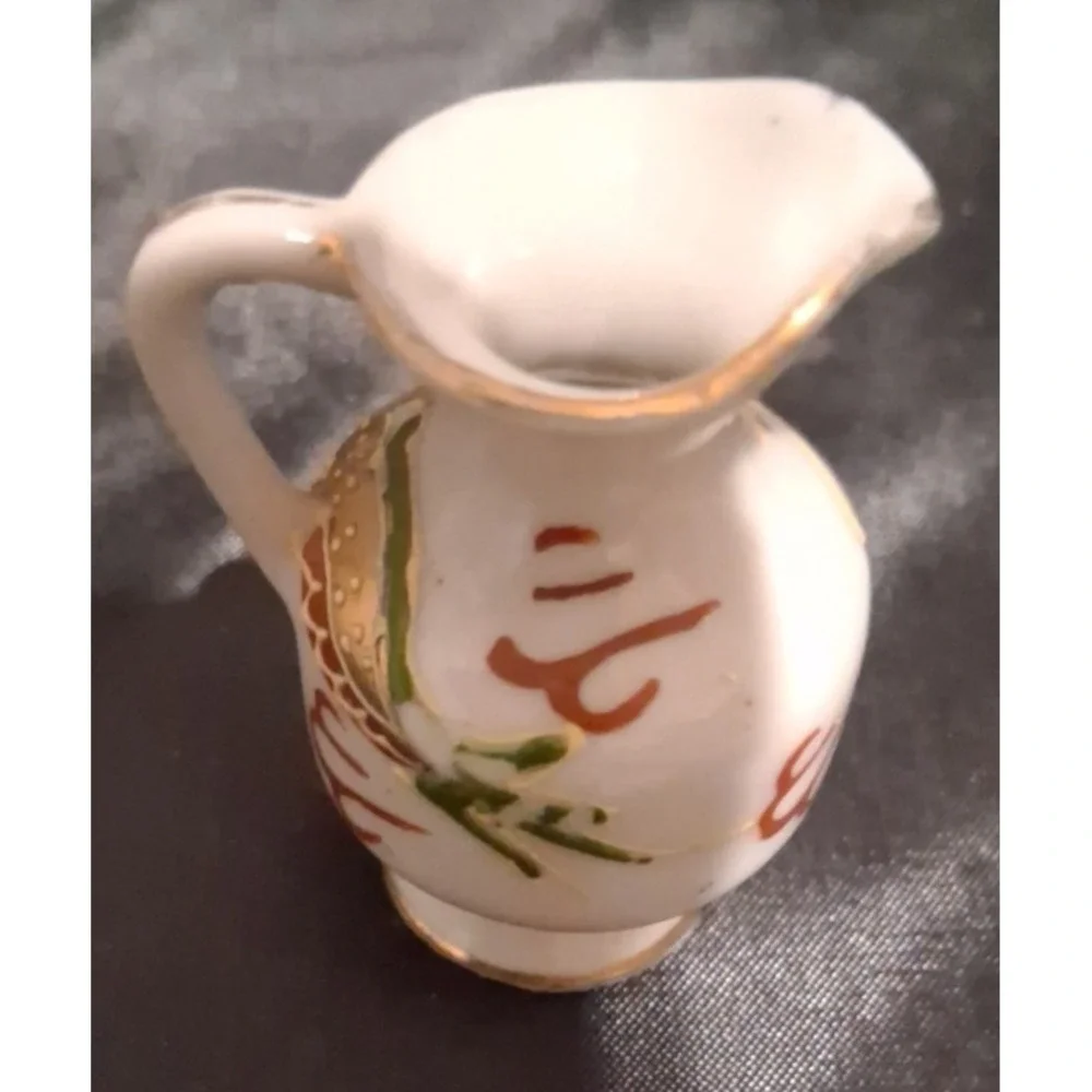 Collection of Seven Vintage Miniature Ceramic Bud Vases with Hand-Painted Design